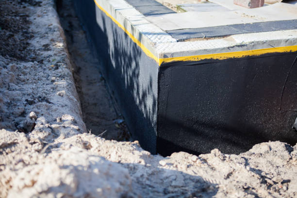 Professional Exterior Waterproofing technician working in Wichita, KS
